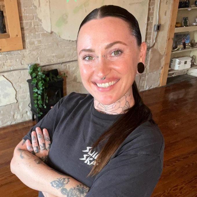 Woman in a yoga studio with text about yoga classes with Megan Moon.